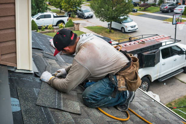 Professional Hail Damage Roof Repair technician working in Hurley, SD